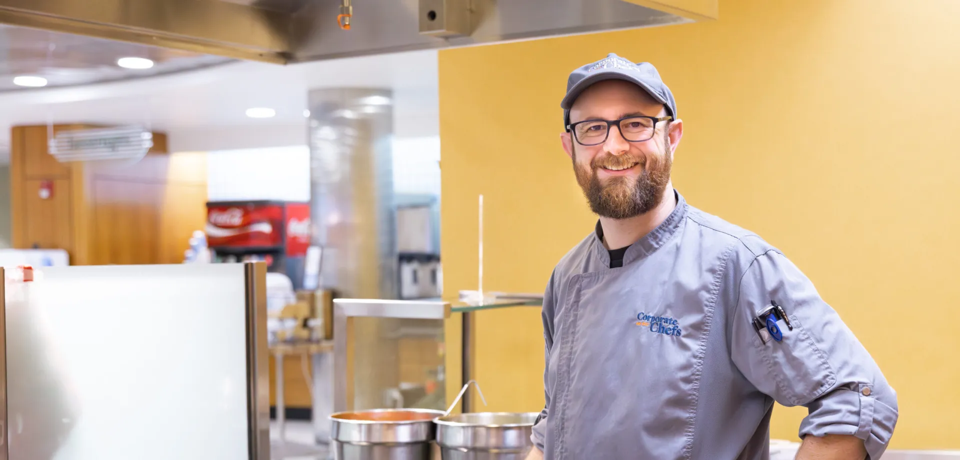Chef Chris in commercial kitchen cooking in saute pan