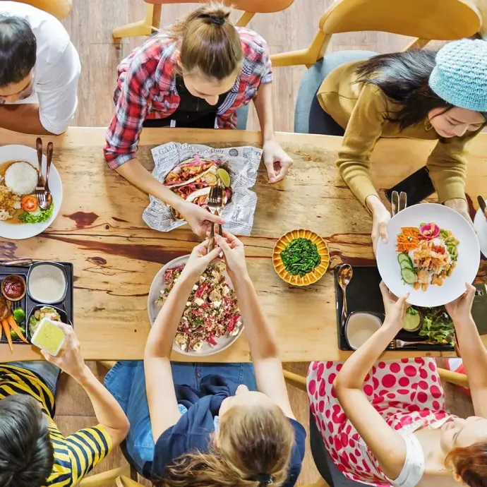 Overhead view or table with people sharing food