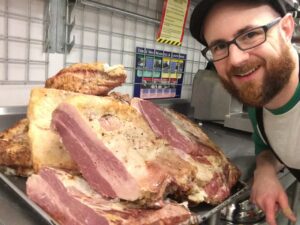 Justin cooking for his guests in Bedford